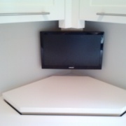 TV over rising cabinet 